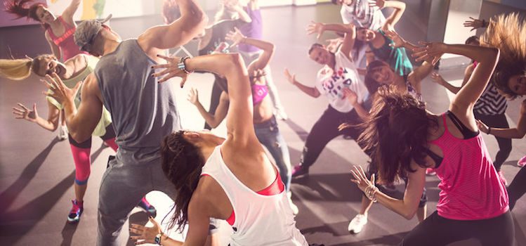 56319709 - group of dancer at zumba fitness training in studio